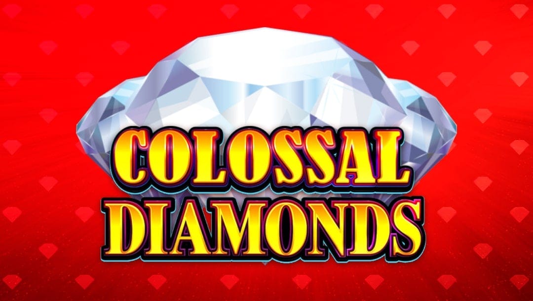 The title screen for Colossal Diamonds. The game title is spelled out in gold, capital letters with red and black borders. Behind it, there are three giant diamonds. The red background is decorated by scattered diamond shapes.