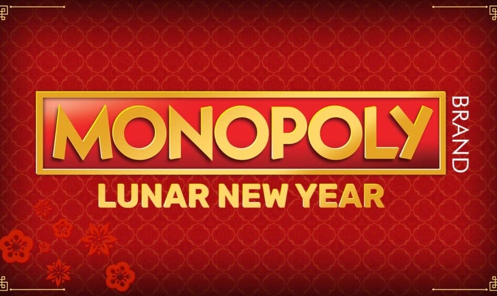 A promotional image for 'Monopoly Lunar New Year,' featuring a rich red background with an intricate pattern inspired by traditional Chinese designs. The golden 'Monopoly' logo is prominently displayed in bold letters, with 'Lunar New Year' written below it in a matching gold font. The design includes decorative elements such as floral motifs and golden corner embellishments, reinforcing the festive theme of the Lunar New Year.