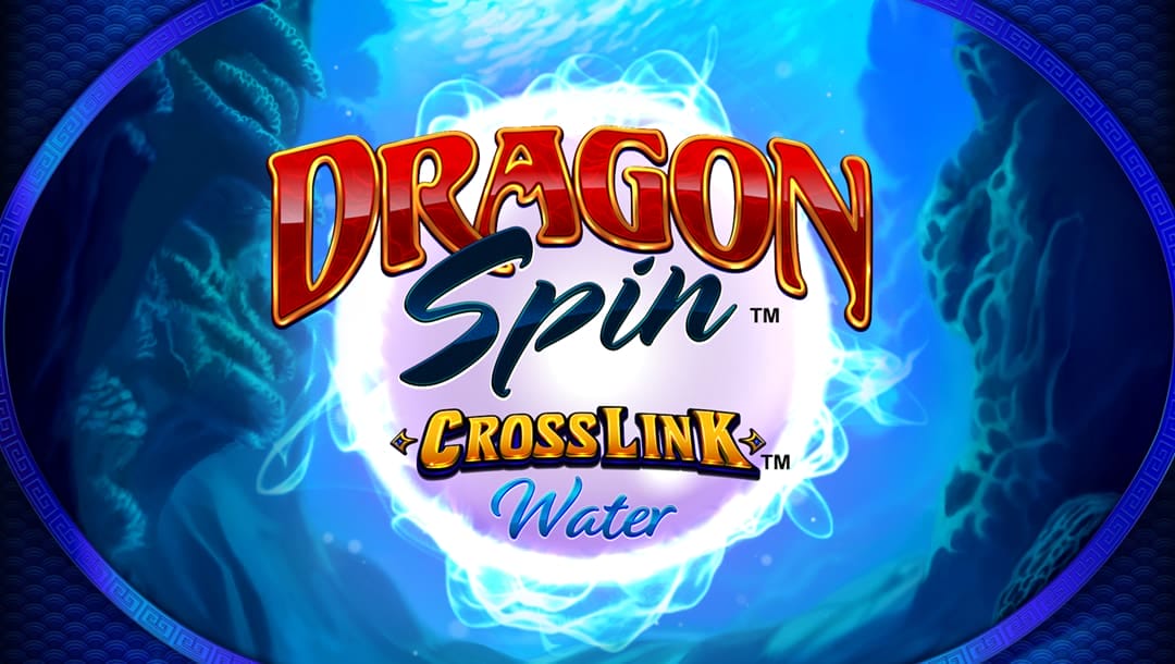 The Dragon Spin Crosslink Water title screen. The setting is a reef underwater with you looking through a large oval-shaped window. In the center of the screen is a glowing pearl-like object surrounded by strange energy. In front of the spherical object is the game title.