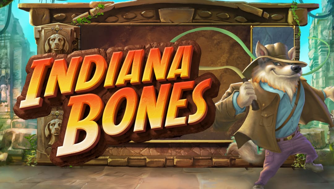 The page title for the Indiana Bones online slot game with the title written in the same style with orange and yellow colors as the title of the original Indiana Jones movie. A dog wearing a hat and clothes cracks a whip in front of a background of an old stone city with dog statues and ruins.