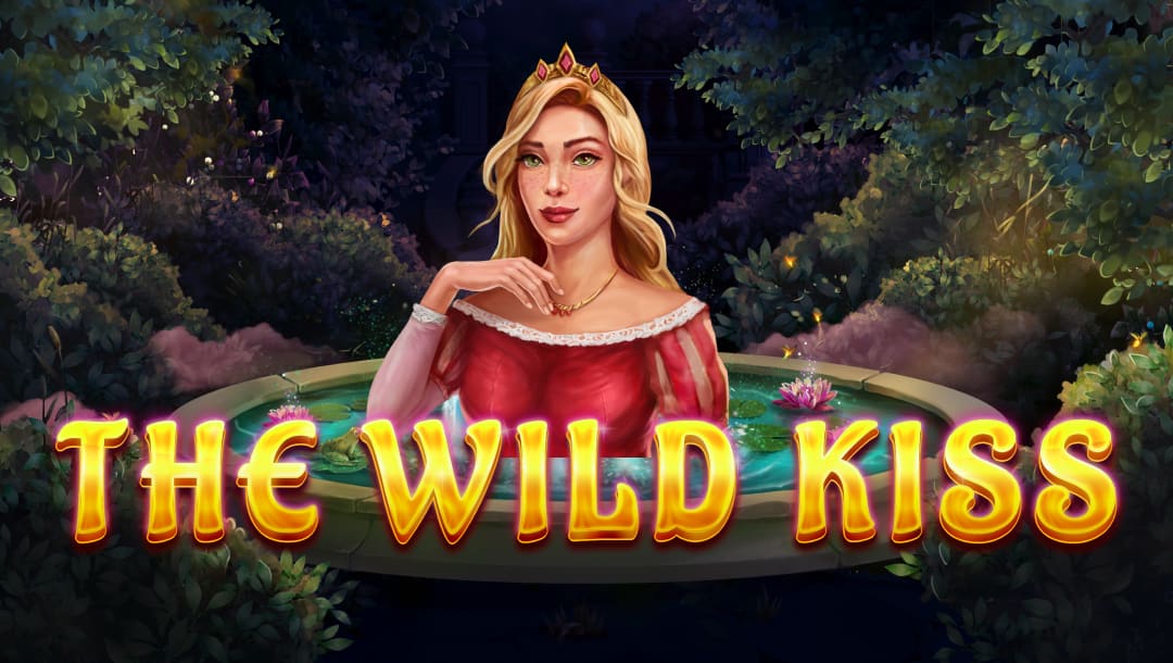 The title screen for The Wild Kiss slot game. A beautiful blonde princess in a dark pink dress appears behind the game title, which is spelled out in shining gold letters. The background is a beautiful scene of a fountain surrounded by thick bushes and trees. The scene is lit by the soft glow of fireflies.