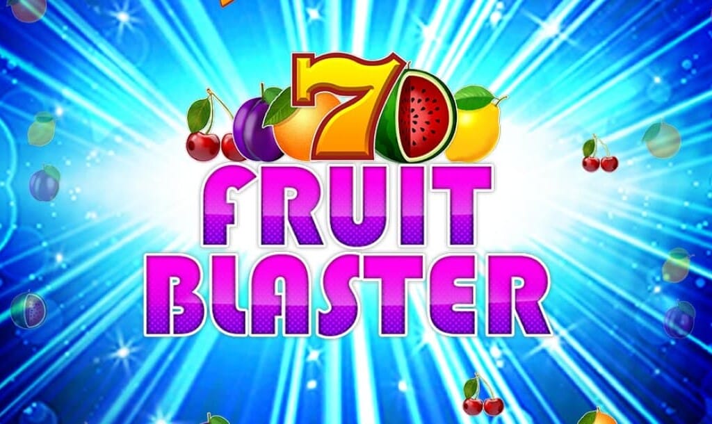 Bright and colourful slot game screen featuring the title "Fruit Blaster" in bold pink and purple letters. Above the title is a large red and yellow number 7 surrounded by various fruits like watermelon, lemon, cherry, plum, and grapes. The background features radiant blue light rays and floating fruit symbols.