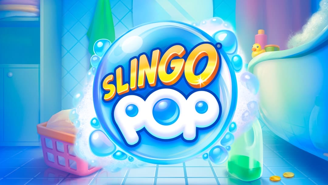 The Slingo Pop banner. The background is a bright blue and white bathroom. There’s a bathtub on the right with bubbles and a rubber duck, detergent, and a laundry basket on the floor, and a laundry cupboard on the left. In the foreground is the game logo with the word Slingo in a gold and yellow font and the word Pop in a white and blue bubble-style font. These words are set against a large bubble surrounded by soap suds.