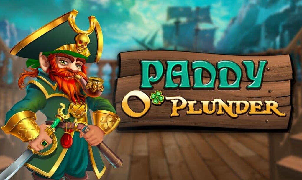 A vibrant cartoon-style image featuring a red-bearded pirate leprechaun in green and gold attire, holding a sword and smoking a pipe, standing confidently on a ship deck. To the right, a wooden sign displays the game title "Paddy O'Plunder" with a shamrock replacing the apostrophe in "O’", and a pirate ship sails in the misty background.