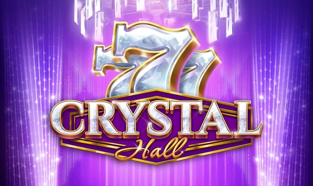 The Crystal Hall title screen featuring shimmering, diamond-studded 7s symbols above the game title written in elegant white and gold lettering. The background is a glowing purple stage with cascading crystal chandeliers and radiant light beams.