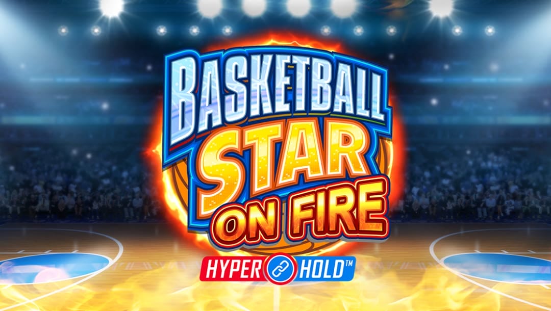 A banner image with the game title Basketball Star on Fire Hyper Hold against a flaming basketball. The title is a mix of bold fonts with silver, orange, and various other colors and strong outlines. In the background is a floodlit basketball court with fans packing the stands.