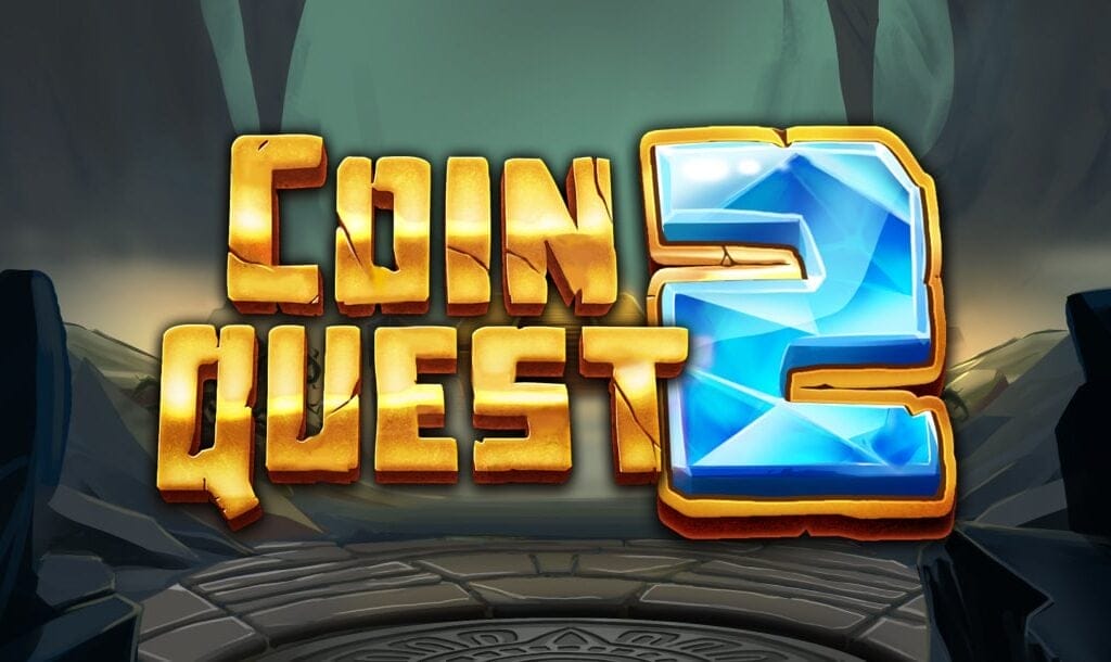 Promotional image for the slot game “Coin Quest 2.” The title is displayed in large, bold letters with “Coin Quest” in gold and the number “2” in bright, gem-like blue. The background shows a mystical stone chamber or cave with glowing light filtering in from above.
