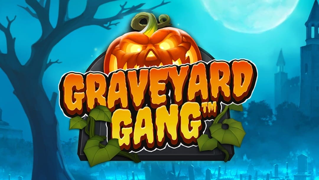 The slot game title “Graveyard Gang” appears in glowing spooky orange letters against a Halloween pumpkin with glowing eyes. The pumpkin is floating in front of a moonlit graveyard with a castle, eerie trees, and a full moon in the background.