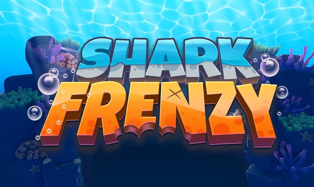 The game title “Shark Frenzy” appears in blue and orange letters slanted above a reef with green and purple coral.