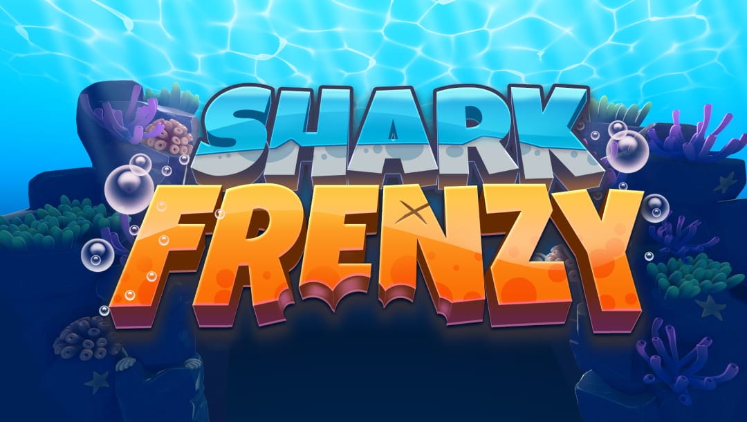 The game title “Shark Frenzy” appears in blue and orange letters slanted above a reef with green and purple coral.
