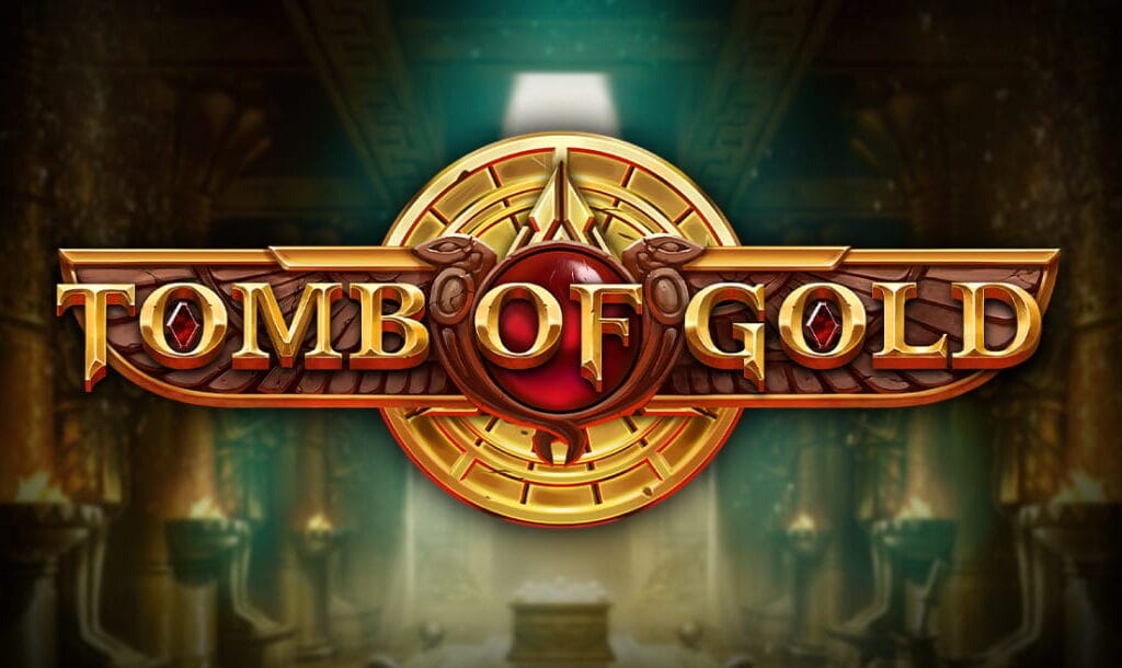 The Tomb of Gold logo featuring gold letters and red jewels. The title appears in the center of the screen on a winged decoration with a gold sphere behind it. The blurred backdrop resembles an ancient Egyptian tomb with braziers against the walls and a sarcophagus in the middle.