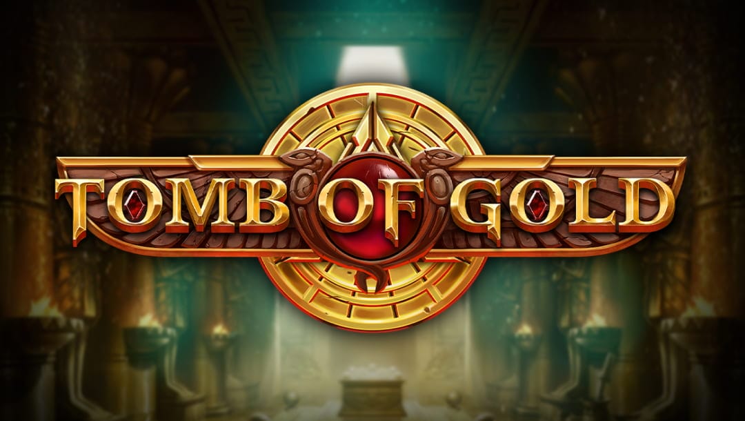 The Tomb of Gold logo featuring gold letters and red jewels. The title appears in the center of the screen on a winged decoration with a gold sphere behind it. The blurred backdrop resembles an ancient Egyptian tomb with braziers against the walls and a sarcophagus in the middle.