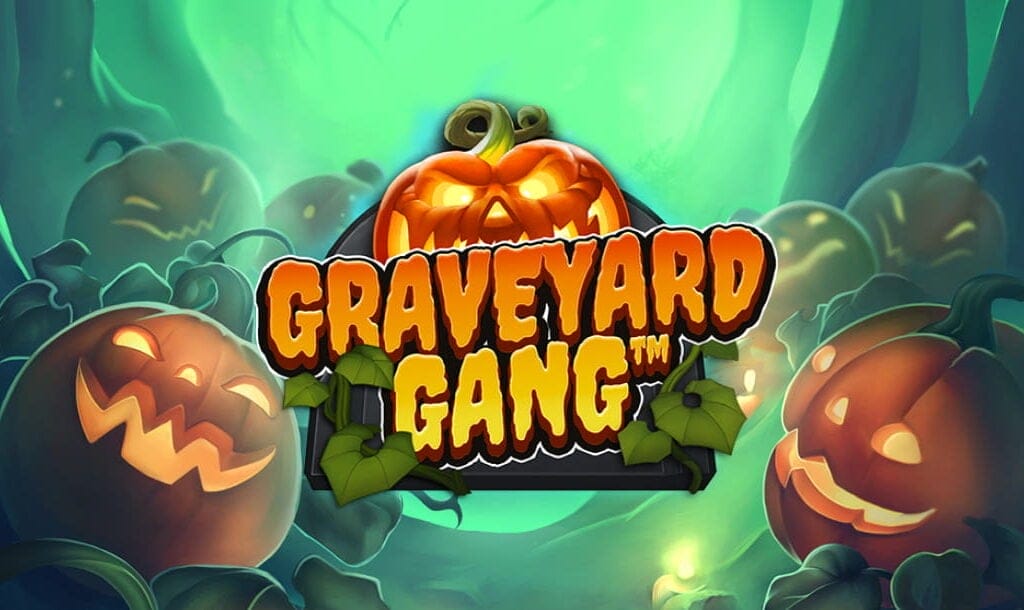 The banner image for the Graveyard Gang slot. It features the title "Graveyard Gang" in bold, orange, cartoon-style letters with green vines wrapping around the text. Behind the title is a glowing, menacing jack-o'-lantern with a carved, angry face. The background depicts a spooky, misty graveyard with several other jack-o'-lanterns showing various mischievous expressions, all set against a backdrop of shadowy trees and a teal-green eerie glow.