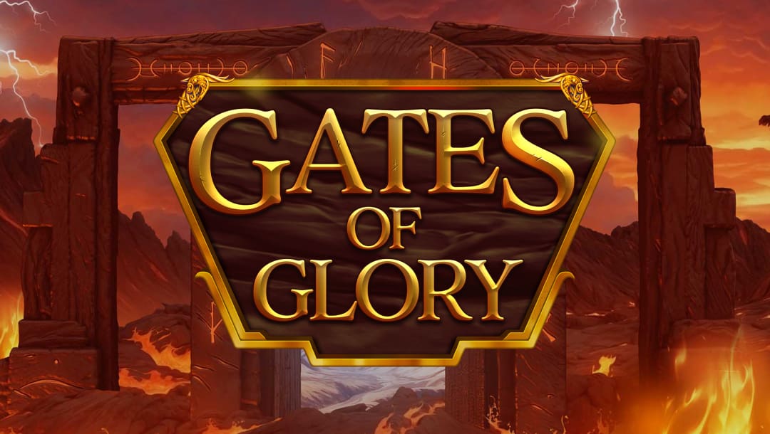 The title screen for the slot game Gates of Glory. In the foreground, bold golden text reading “Gates of Glory” is set within a polished dark wooden plaque bordered with gold. The background showcases a dramatic, fiery landscape with volcanic elements, glowing lava streams, and rocky mountains under a burning orange sky. Dark wooden gateposts engraved with runes frame the center. Lightning bolts streak through the sky, while the overall color palette combines intense reds, oranges, and browns to evoke heat, power, and ancient legend.