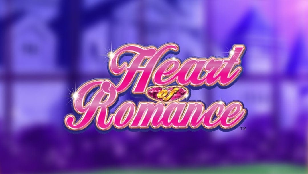 The Heart of Romance logo features pink and gold letters with cursive writing. A heart-shaped jewel sits in the middle of the logo behind the word “of”, while the background is a blurred image of a castle seen through the window of a greenhouse garden.
