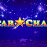 The title screen for the Star Chase slot game, with the game’s name displayed prominently in the foreground in bold, colorful lettering outlined in blue, red, and yellow. A large golden star with a curved purple trail separates the words "STAR" and "CHASE". The background is a deep, glowing blue with scattered, sparkling light effects that resemble distant stars. Silhouettes of five-pointed stars in various shades of purple and pink are scattered across the bottom.