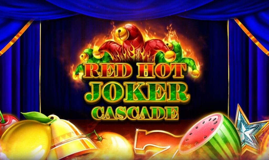 The title “Red Hot Joker Cascade” appears in red and green letters against a theater with blue velvet curtains. There’s a joker’s cap above the title and classic fruit machine symbols below.