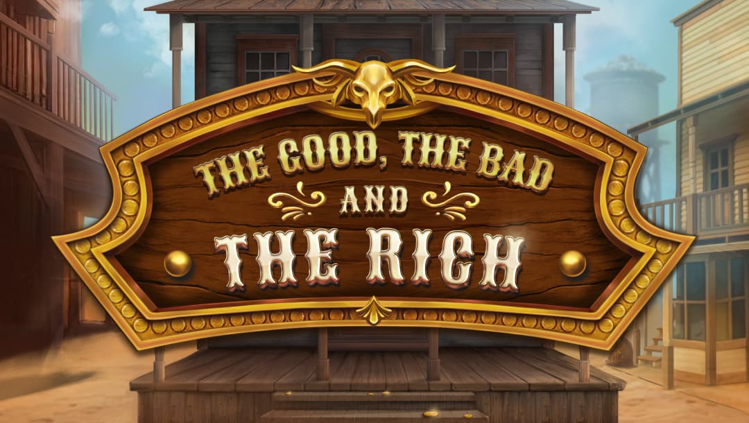 The game title The Good, the Bad and the Rich appears in gold and silver letters on a curved wooden sign above a wooden stage in the middle of a dusty street in a Western town.