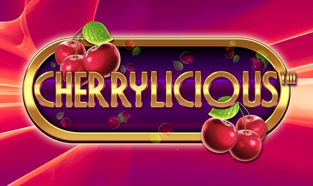 The game title “Cherrylicious” appears in shimmering gold letters in an oval gold frame decorated with red cherries. More cherries float in the deep purple background, while the frame is surrounded by bands of red and orange color.