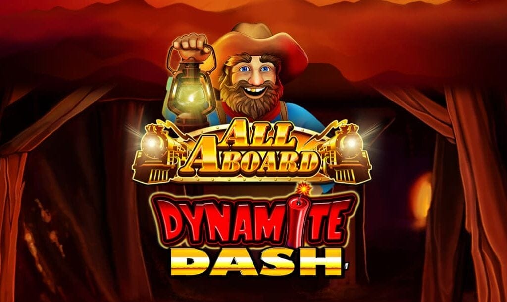 All Aboard Dynamite Dash game title screen with the logo in the foreground, floating in front of the entrance to a mining shaft. The logo features the friendly miner character with a solid gold tooth sparkling in his smile, while the text elements feature metallic gold and dynamite red accents.
